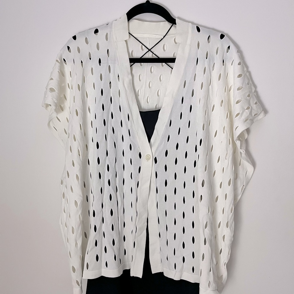 Drapey white sweater cardigan with hole details.